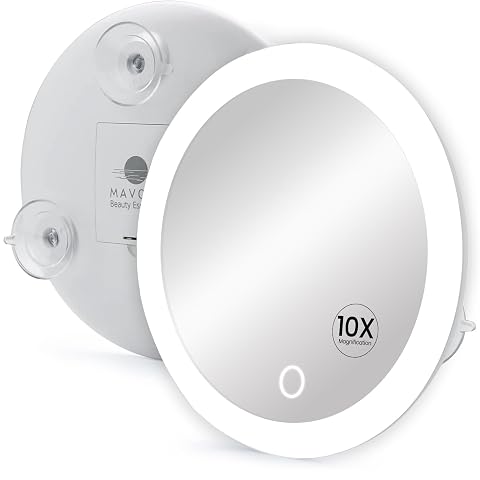 Miroir grossissant rond Mavoro avec anneau LED, fixé sur un carreau clair de salle de bain