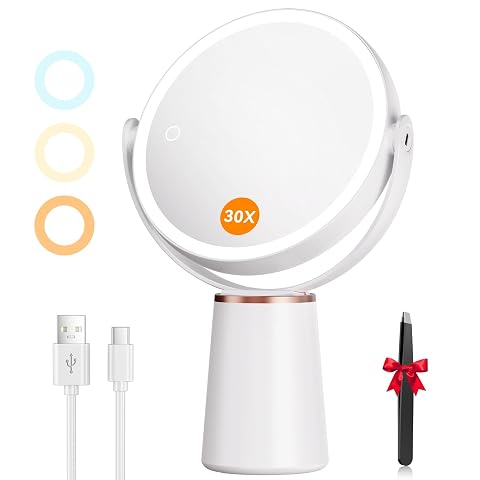 Miroir de maquillage blanc à poser, double face et éclairé par des LED dans une salle de bain claire.