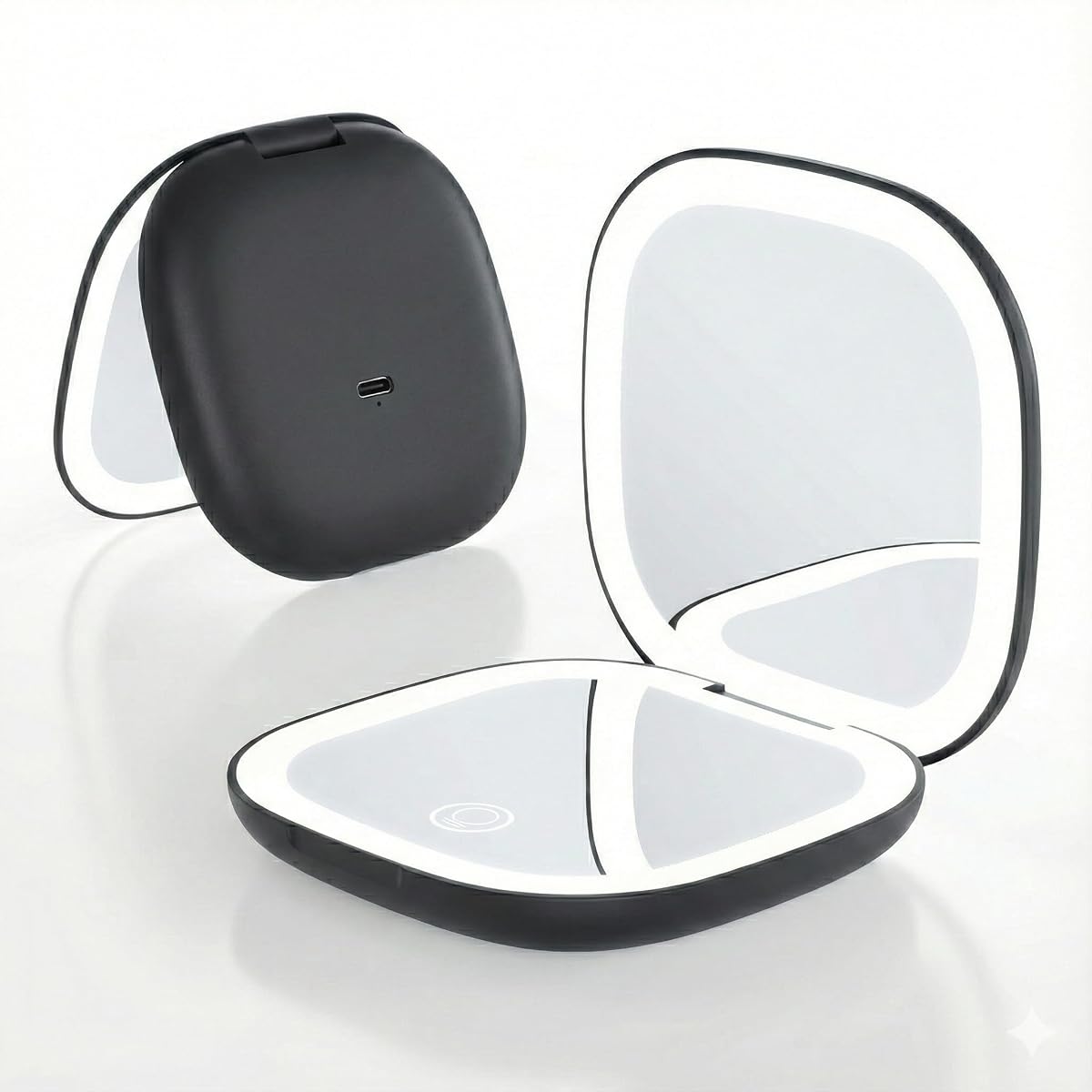 Miroir de maquillage compact noir ouvert, avec anneau LED, posé dans une salle de bain claire.