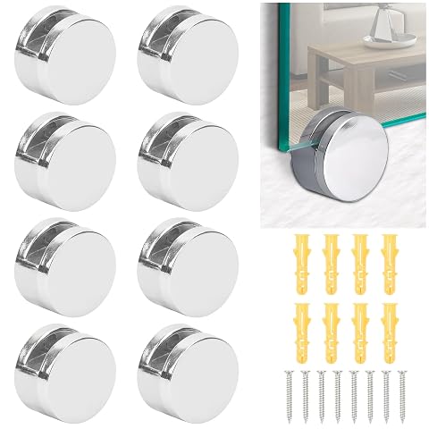 Huit clips argentés pour miroir, avec huit vis et huit chevilles sur une surface claire