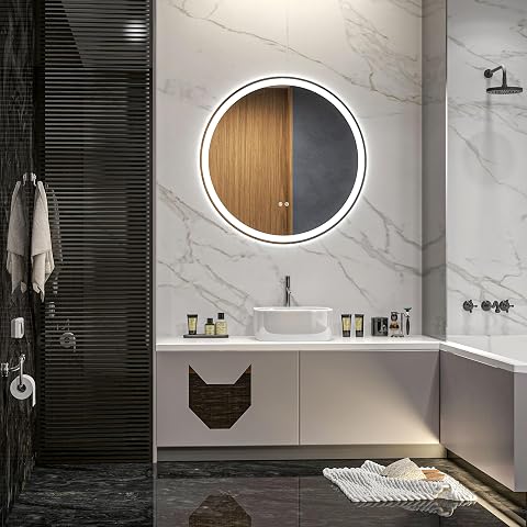 Miroir rond Kleankin à éclairage LED frontal fixé sur un mur de salle de bain en pierre claire.