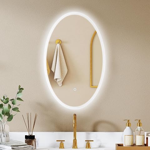 Miroir ovale mural Homcom à éclairage frontal et rétroéclairé dans une salle de bain claire
